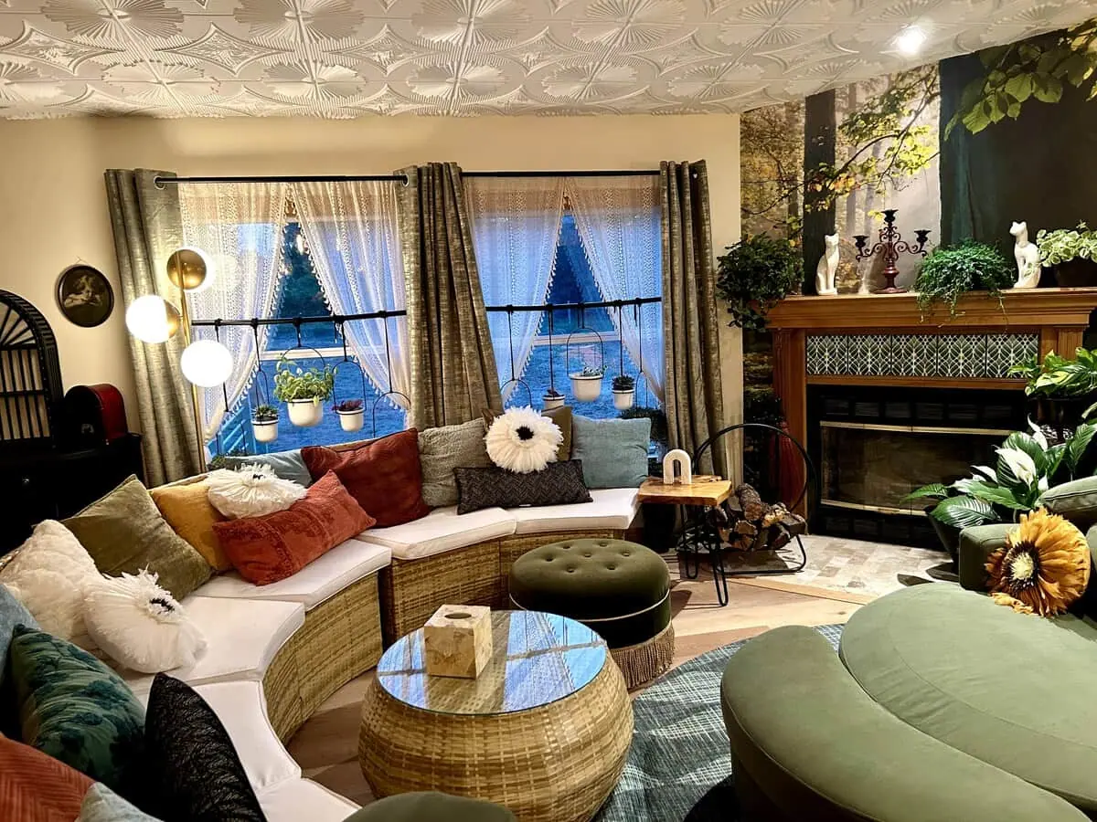 The curved sofa by the fireplace