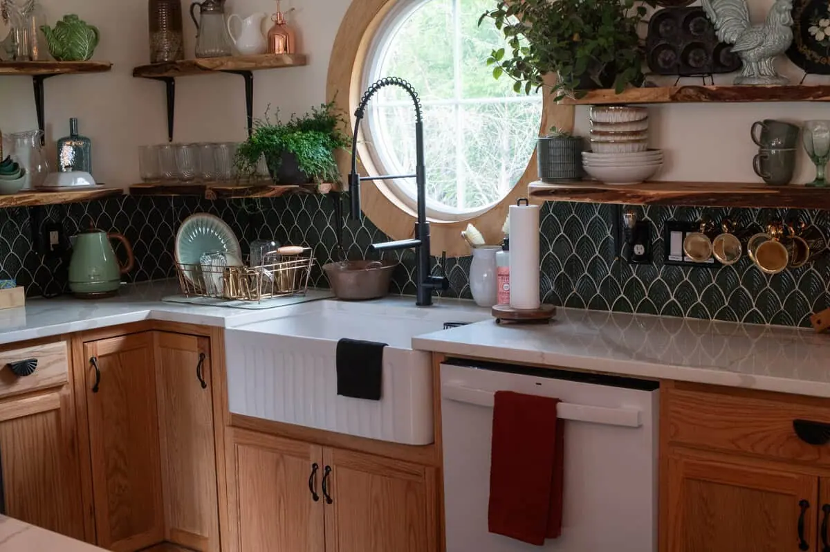 The kitchen sink beneath a round window